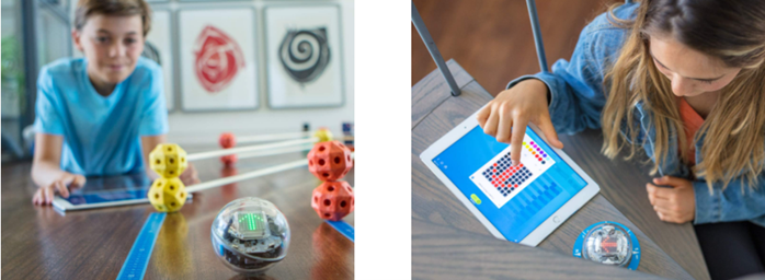 Niños manejando el robot Sphero Bolt