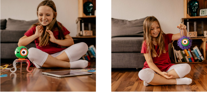 niña jugando con el robot dot y el kit de creatividad